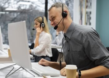 colleagues-working-together-call-center-office-with-coffee-scaled.jpg